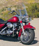 The Road King's easily detached windshield offers the least weather protection (which is good or bad, depending on the temperature) with a width of 23.0 inches and no standard lowers. Harley's accessory catalog offers plenty of options.